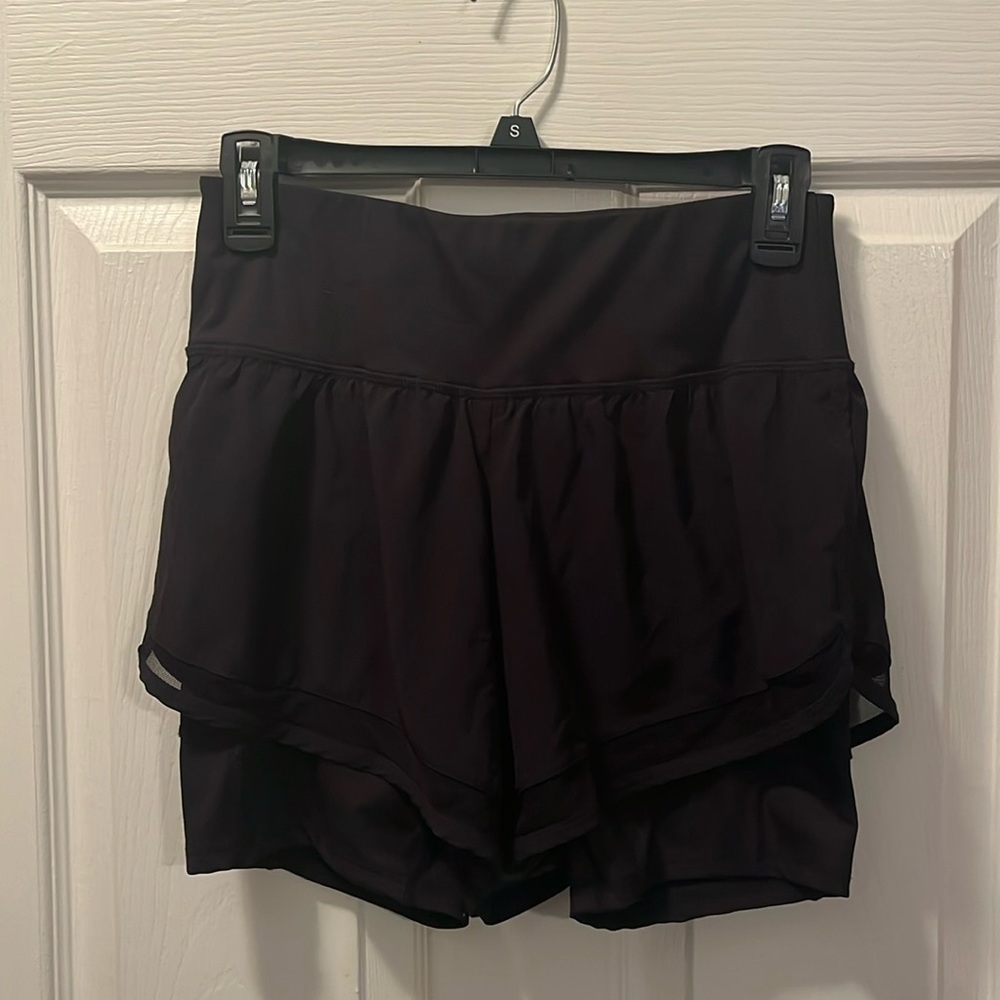 Small black athletic shorts with built in spandex